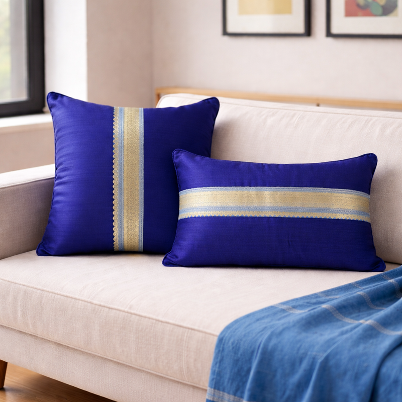 Blue cotton silk cushion set with gold sari border including one square and one lumbar pillow styled together