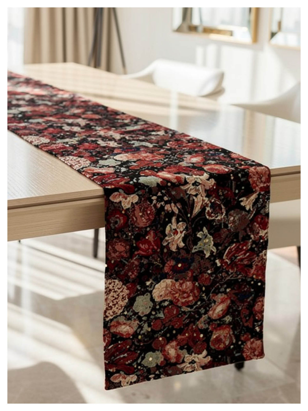 Amber floral jacquard table runner with metallic sequin detailing styled on a dining table