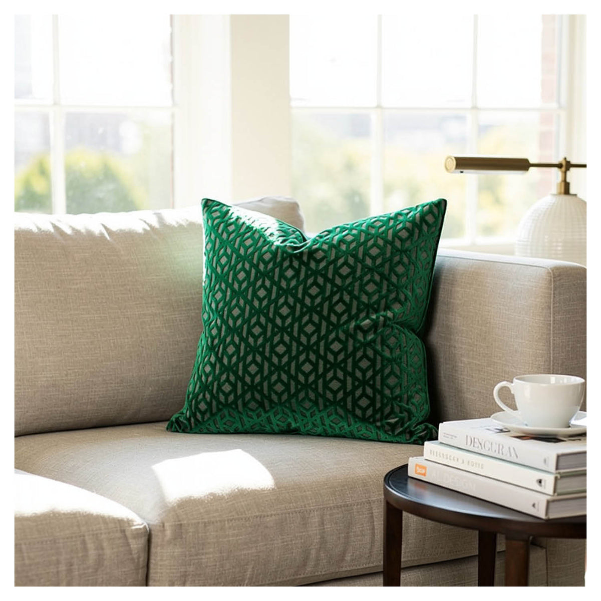 emerald green geometric patterned velvet cushion styled on sofa