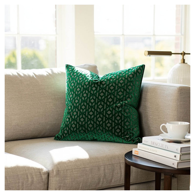 emerald green geometric patterned velvet cushion styled on sofa