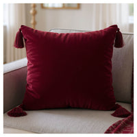 ruby velvet cushions styled on sofa for modern interiors