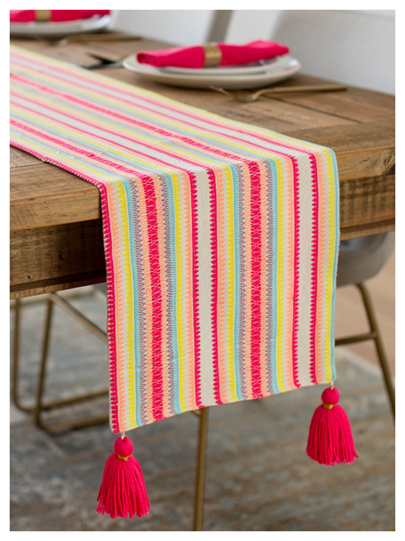 vibrant striped table runner styled on dining table
