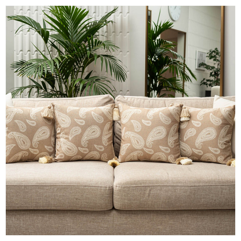 Beige paisley jacquard cushion set of six with tassel detailing styled on a sofa