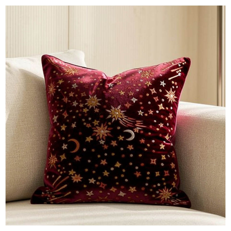 Decorative pillow with celestial pattern on a beige couch