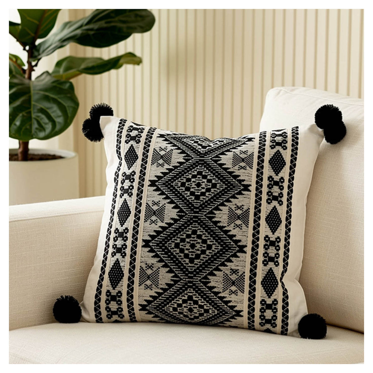 Aztec border cushion set of two with pom-pom edging styled in a monochrome living space
